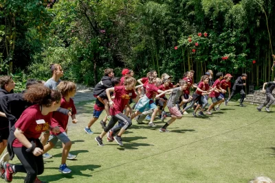 Students running at the lawn of The Last Resort in Nepal